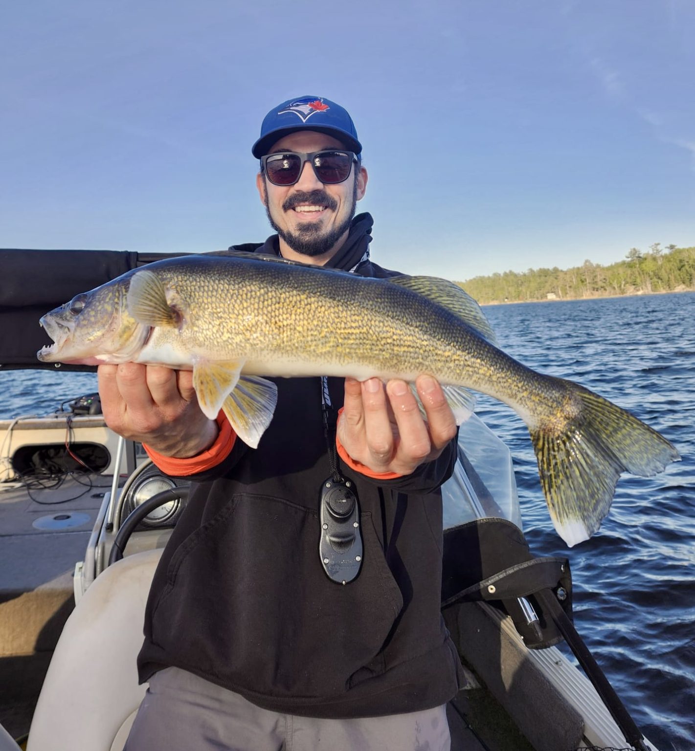Man holding a 22' walleye
